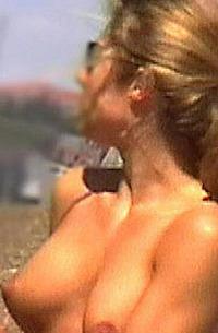Jennifer Aniston topless tanning