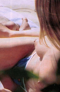 Jennifer Aniston topless tanning
