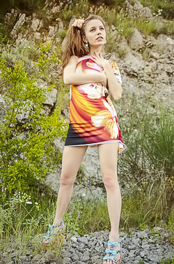 Sofi Shane Mountain climbing red head teen striping on a mountain pass