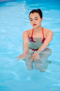 Tutsi Splashes In The Pool In Her Skimpy Scarlet Bikini