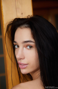 Kama Oxi Runs Her Hands Over Her Sexy Small Breasts