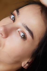 Kama Oxi Runs Her Hands Over Her Sexy Small Breasts