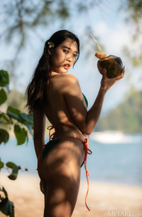 Minari Teases On The Beach Stretching Out In Her Bikini