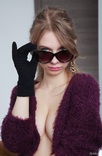Siya teasing in black lingerie and gloves, topless on armchair, blonde solo posing with sunglasses