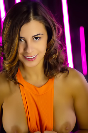 Alice Kelly Voluptuous Beauty Tugs At Her Vibrant Orange Bodysuit