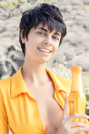 Kensi Dressed In A Bold Orange Crop Top That Hugs Her Perfect Breasts And A Matching Mini Skirt