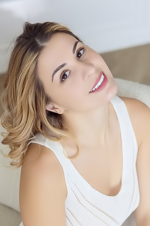 Alice Kelly Dark-eyed Siren Smiles Enticingly As The Straps Slide From Her Shoulders