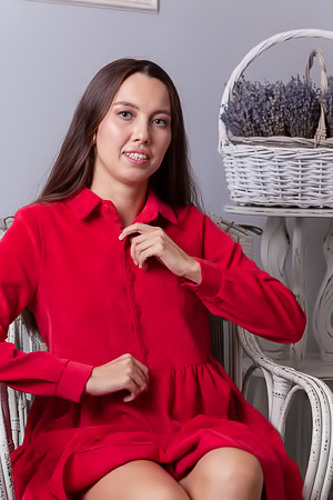 Zarusha Strips Out Of A Red Shirt Dress On A White Wicker Chair